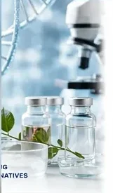Laboratory vials, microscope and plant representing natural medicine research in integrative cancer care